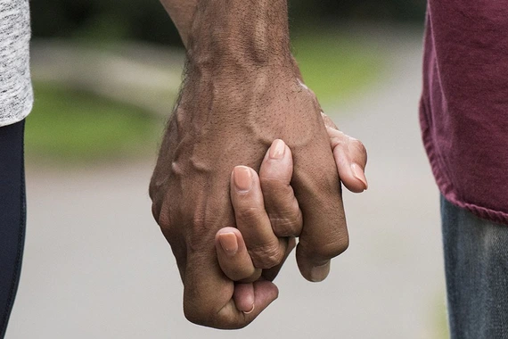 A couple holding hands