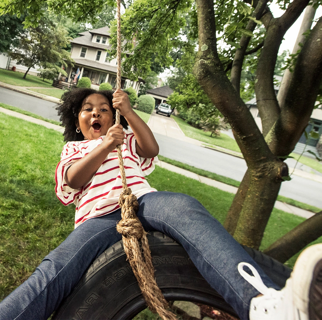Mädchen auf dem Schaukel