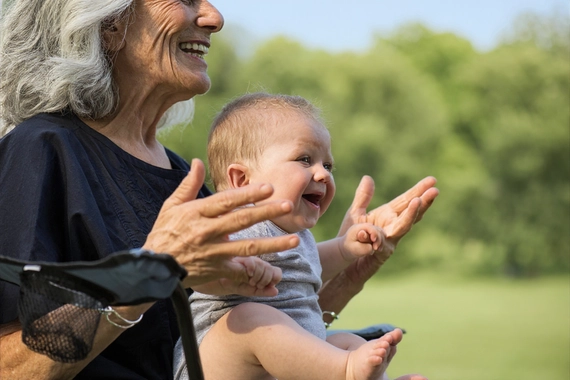 Grandparent and baby outdoors enjoying nature