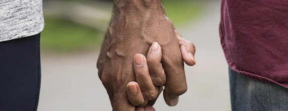 A couple holding hands