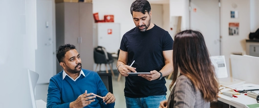 Employees having a discussion at office