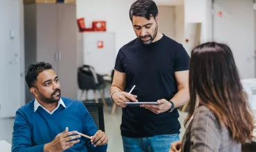 Employees having a discussion at office