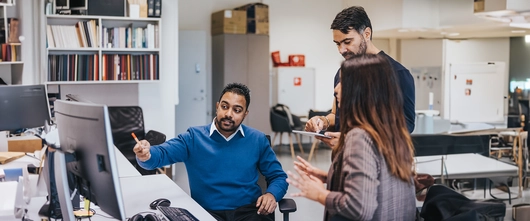 Employees having a discussion at work