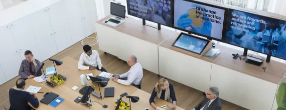 A photo of people in a meeting hall