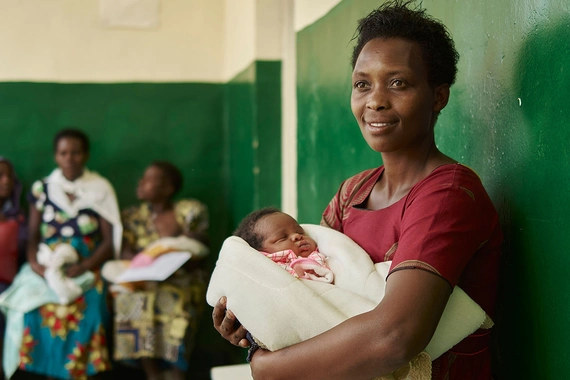 Mother waiting with an infant in a clinic