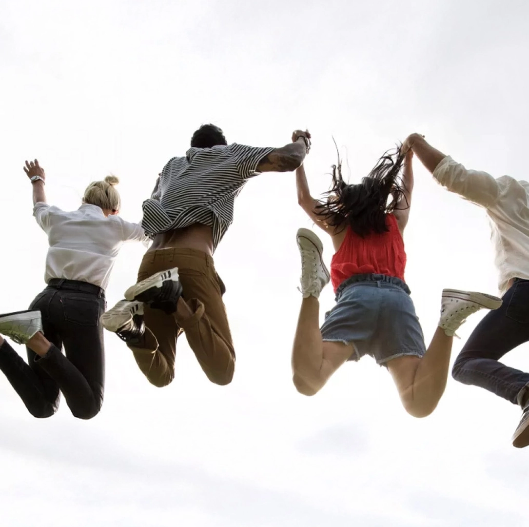 Young adults jumping