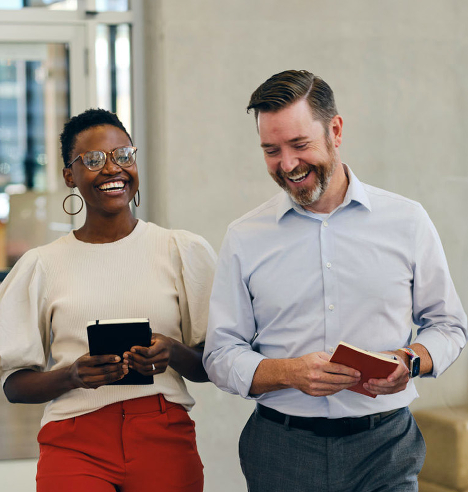 Two business people laughing