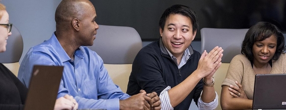A group of people in a meeting