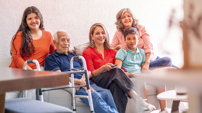 Family sitting on couch 