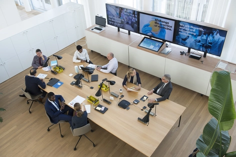 People in a meeting, photographed from above