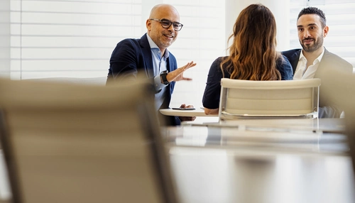 Man and woman behind computer