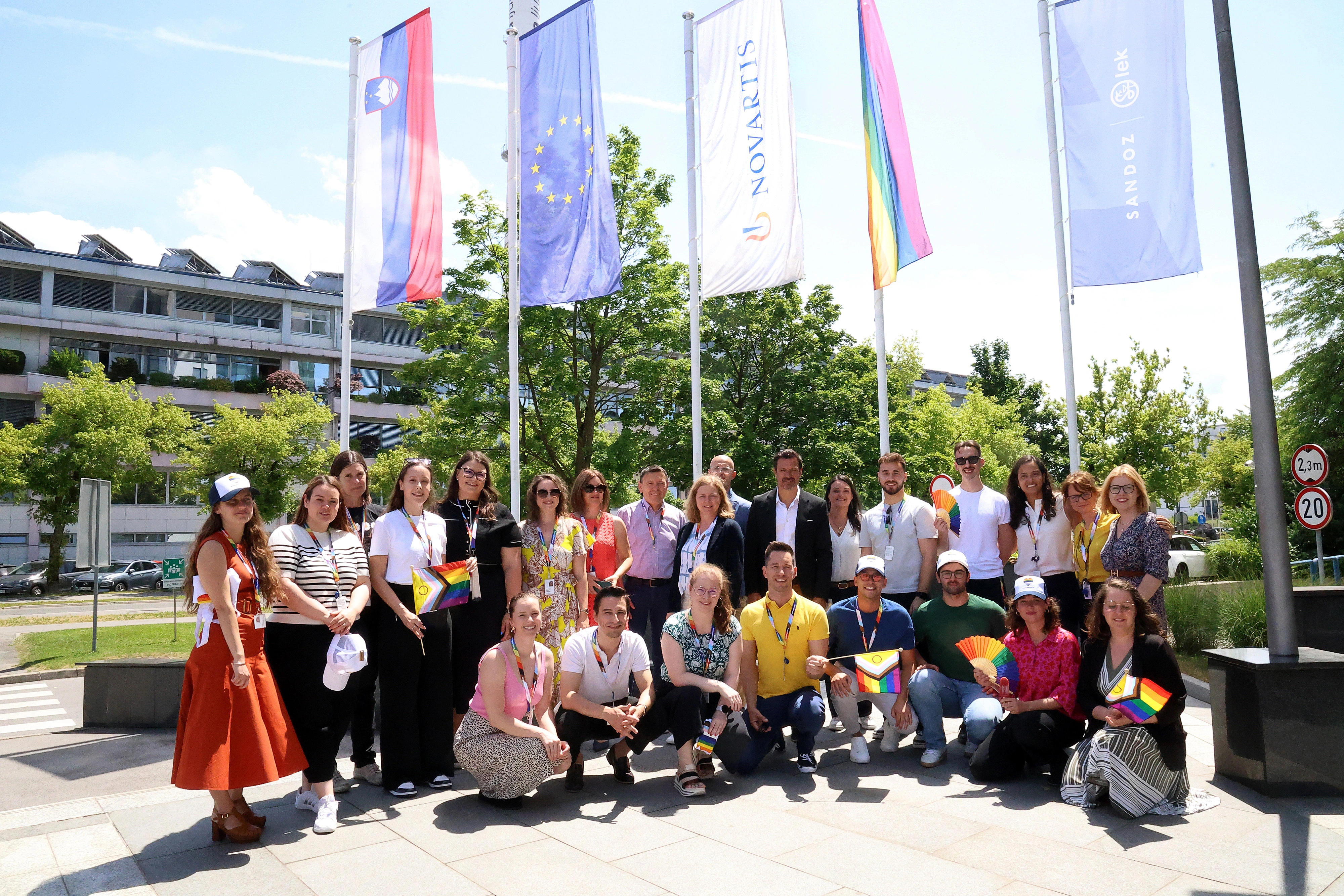 Raising the rainbow flag in front of the Novartis office building in Ljubljana