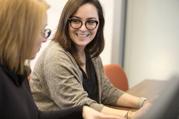 Two women discussing during training