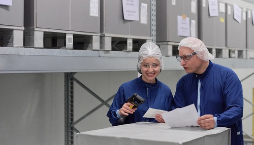 Two people looking at documents