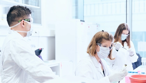 Three scientists working in a modern lab