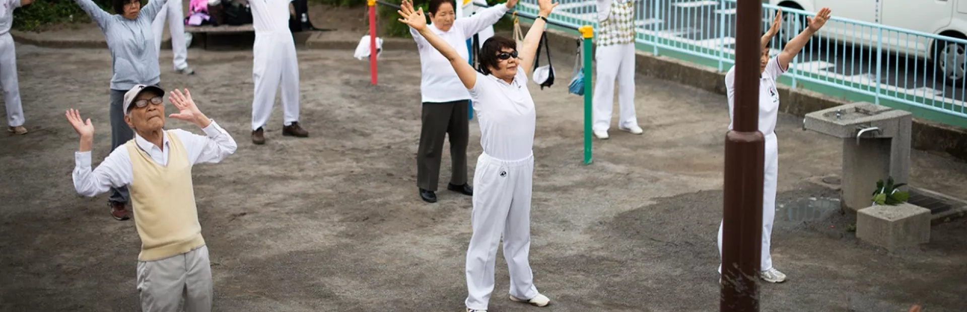 Yuko Yoshikawa and others partake in a communal fitness session outdoors in Tokyo.