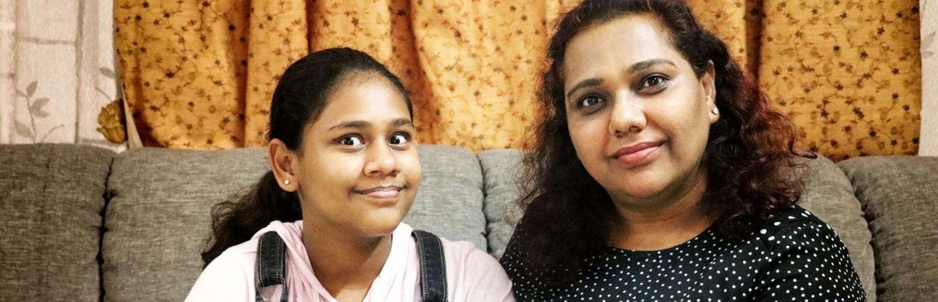 Deepti Mittal sitting with her daughter in Hyderabad, India