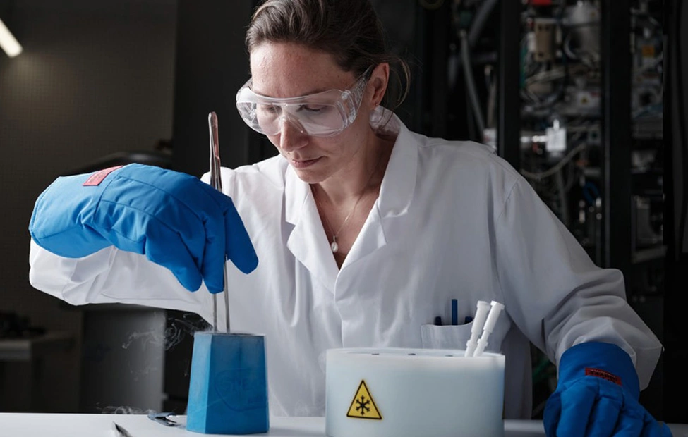 Scientists working in a laboratory with protective gear