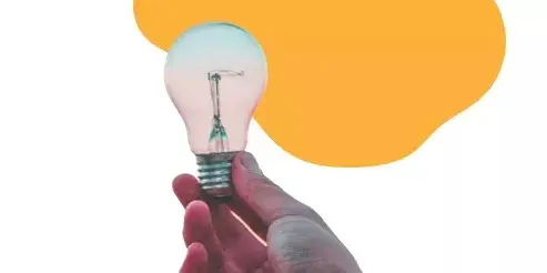 Hand holding lightbulb