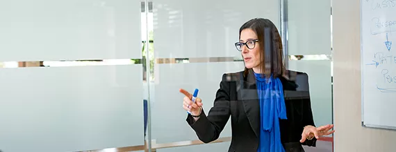 A female business professional leading a presentation