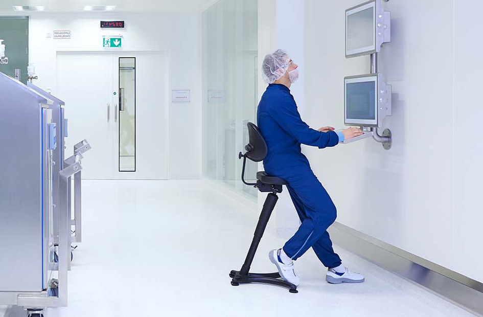 Production specialist working on a computer
