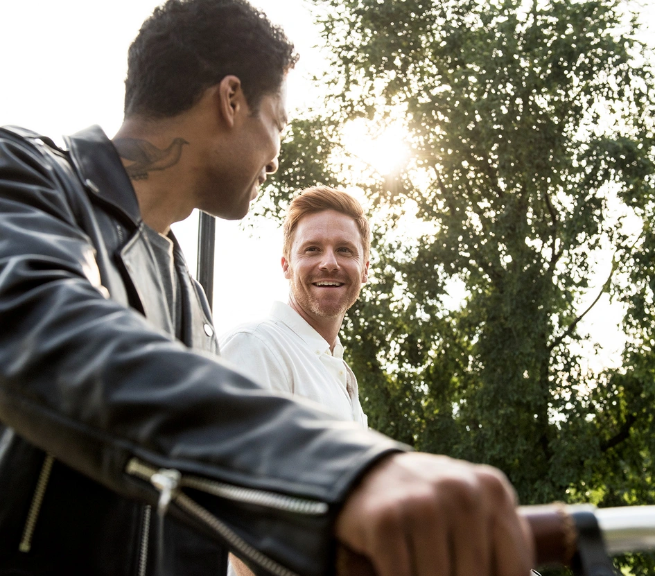 Two men discussion at sunset