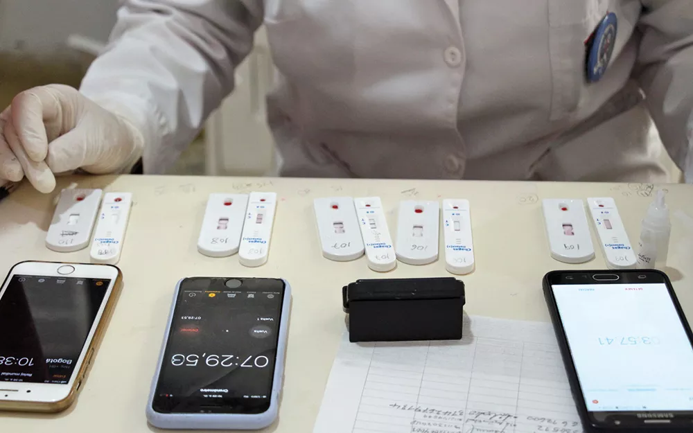 Doctor performs rapid diagnostic tests for Chagas disease.