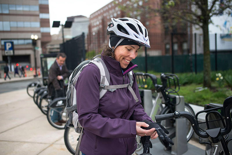 Jennifer preparing herself to bike