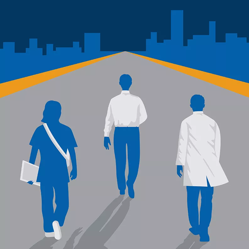 Three people walking on a path with a cityscape in the background.