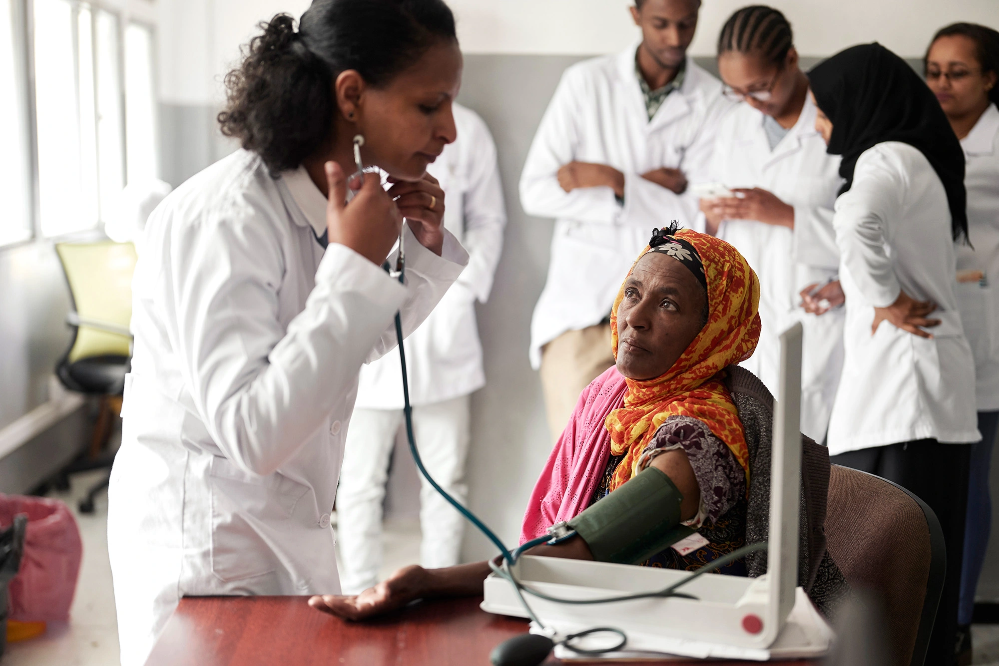 doctor using stethoscope with patient in ethiopia