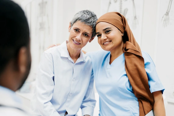 Nurse and patient exchanging a warm moment