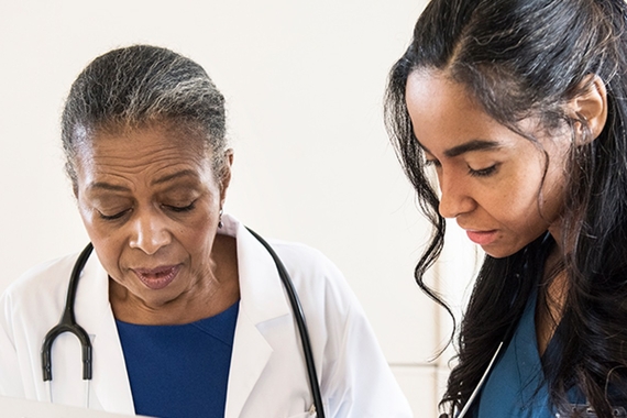 Image of two healthcare professionals interacting
