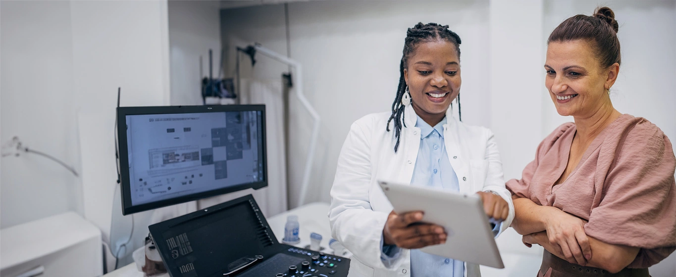 Doctor and patient discussing medical results on an iPad