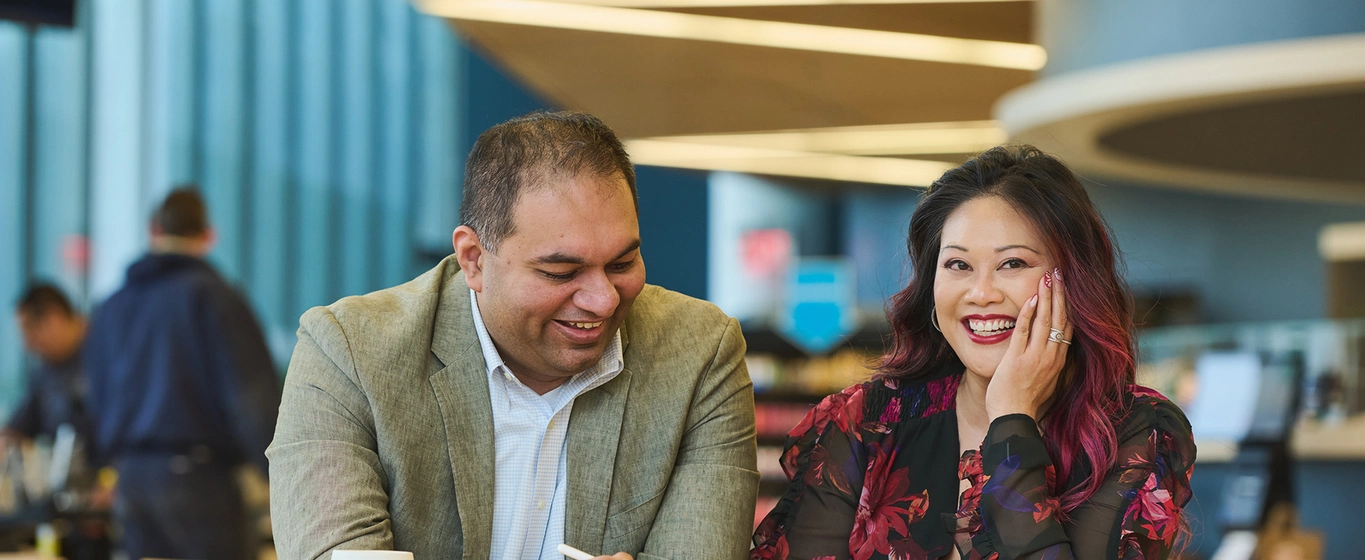 Two business people smiling