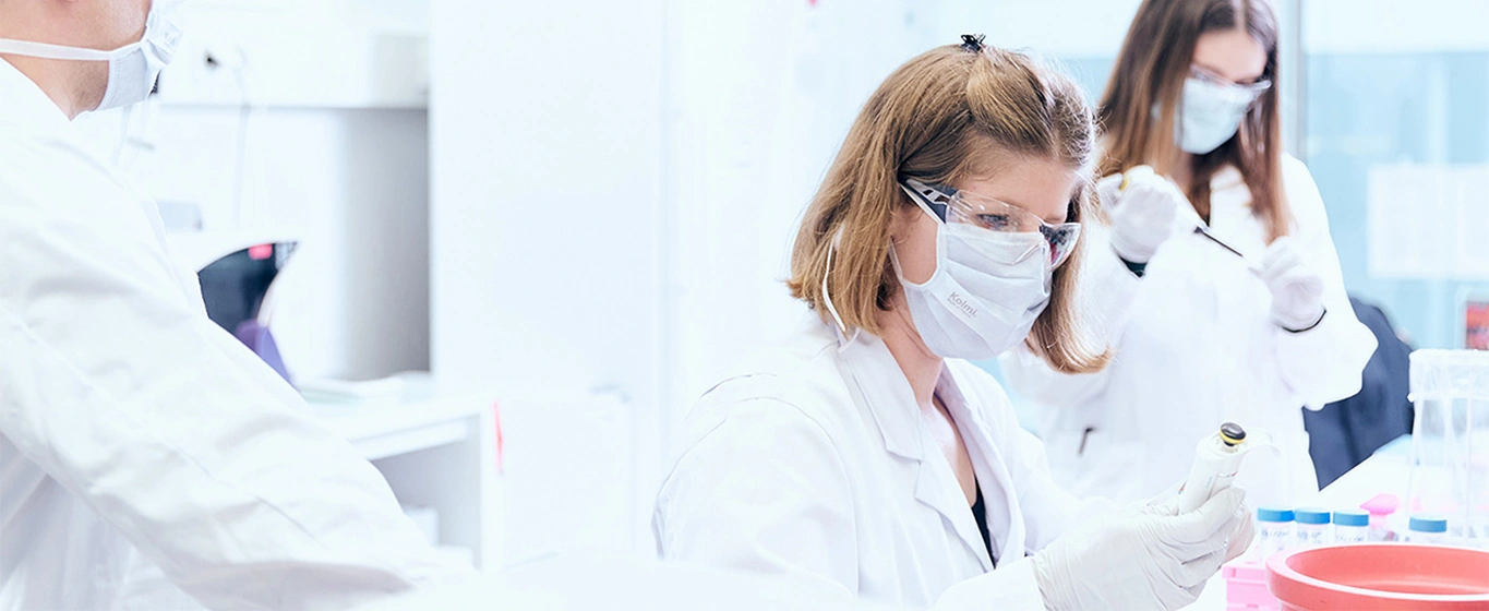 Three scientists working in a modern lab