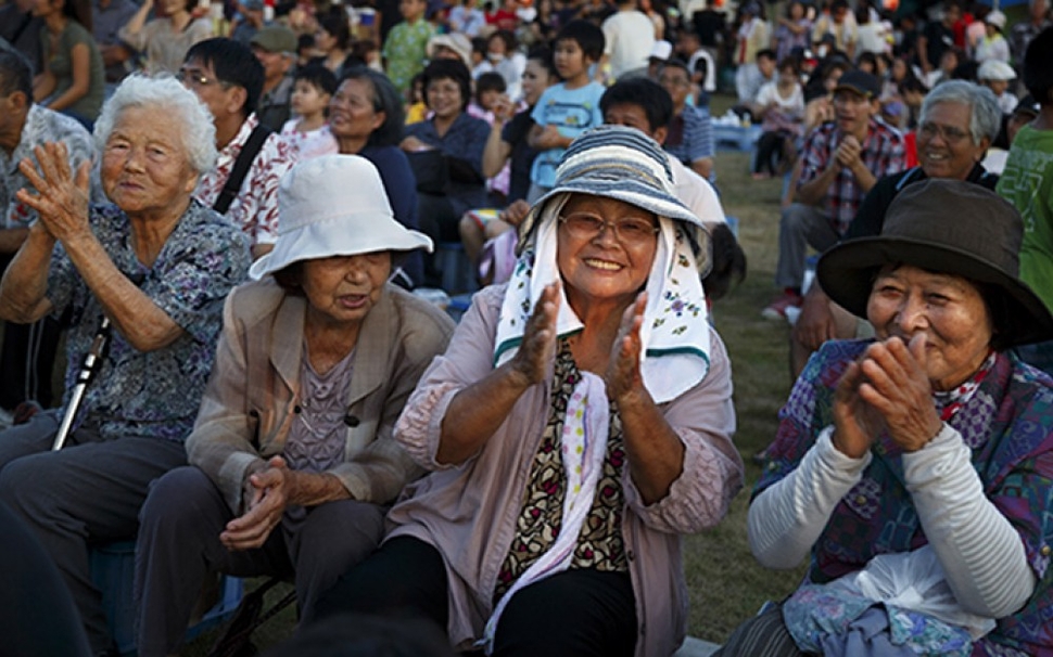 Take Yamashiro, 89, sits among friends