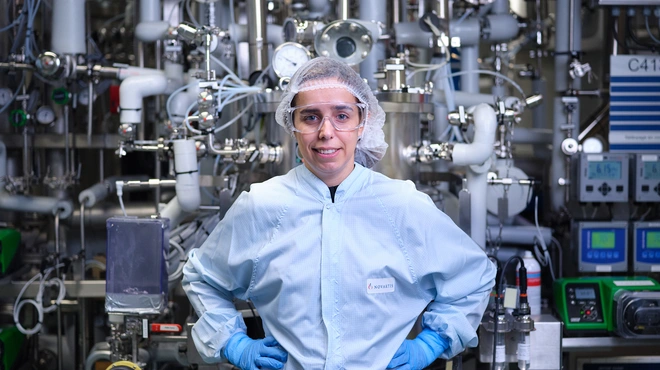 Site head standing in a lab