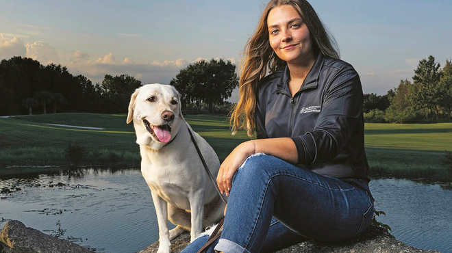 Novartis Annual Report 2024 cover: Kate Kostelyk, IgA nephropathy (IgAN) patient, and her labrador Dakoda in Mims, Florida