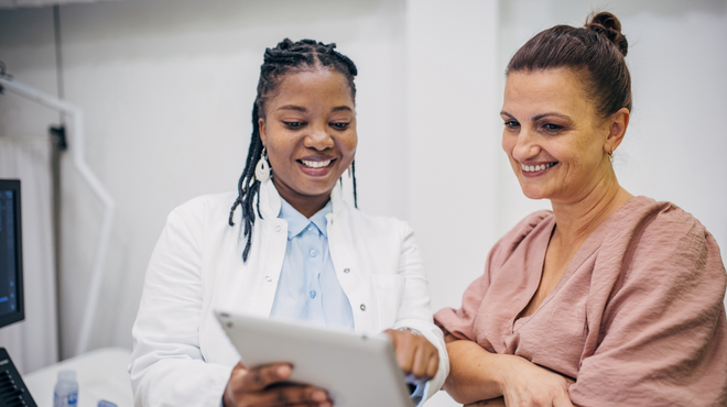 Doctor and patient interacting on medical results