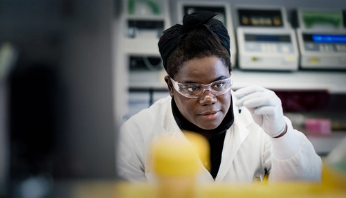 Research scientist in a lab looking at a sample