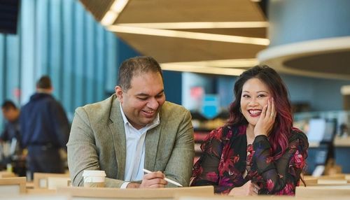 Two business people smiling