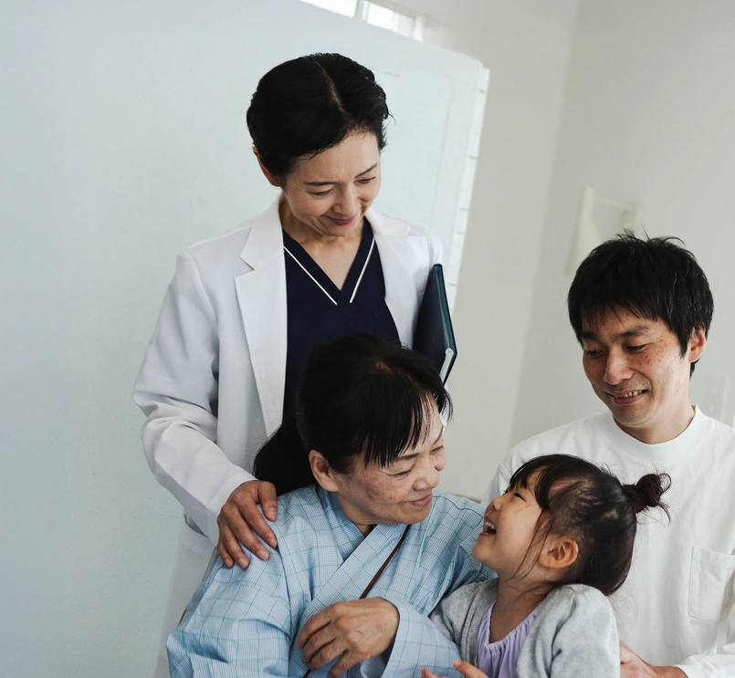 Patient with family around and doctor