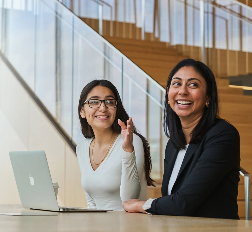 Two business people smiling