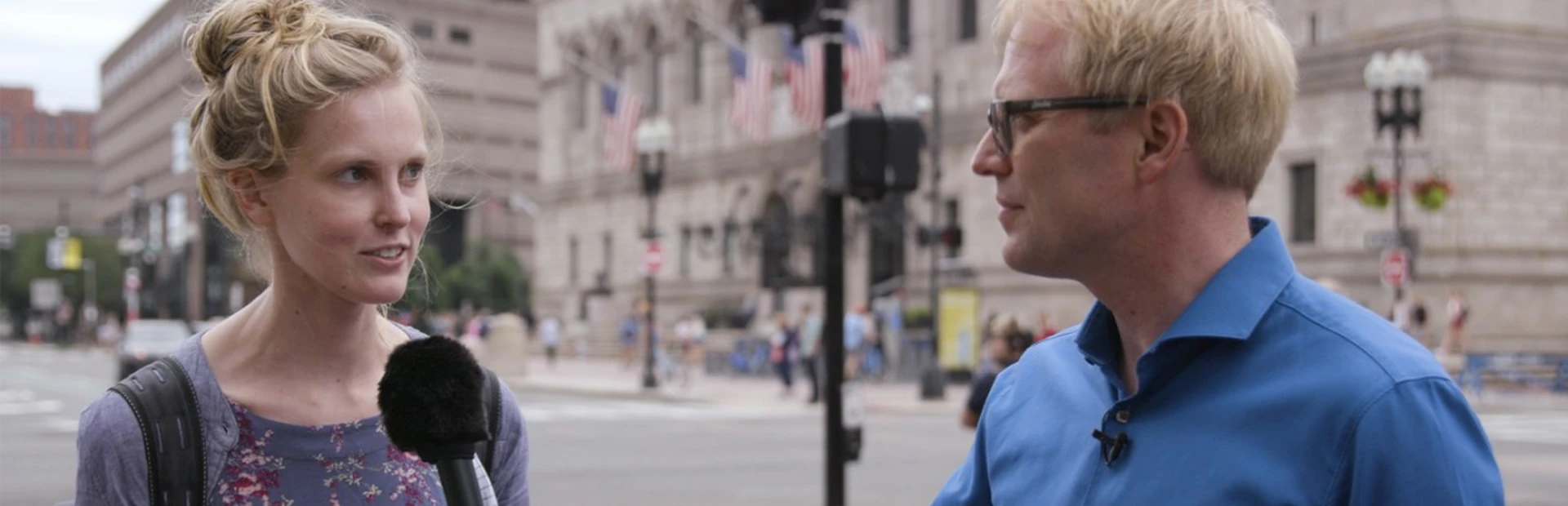 Novartis scientist talks to woman on the street.