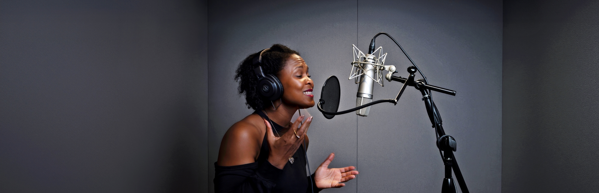 Shanelle Gabriel rehearses a poem in a studio.