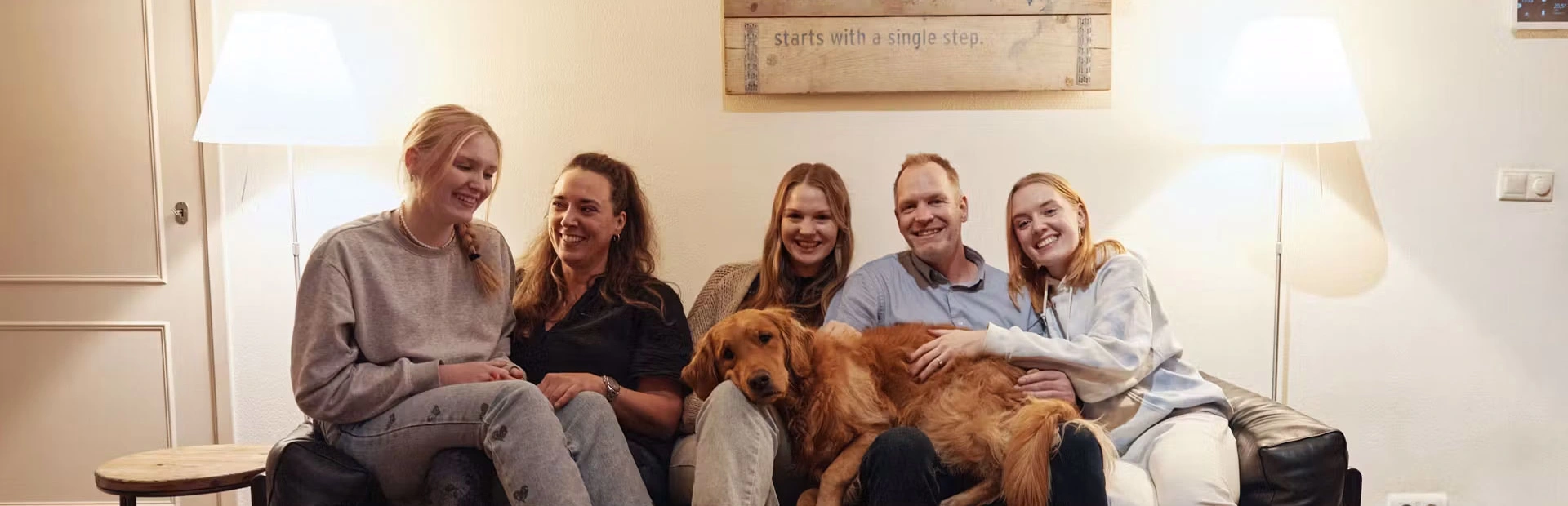 Marc Rijken family sitting on a sofa