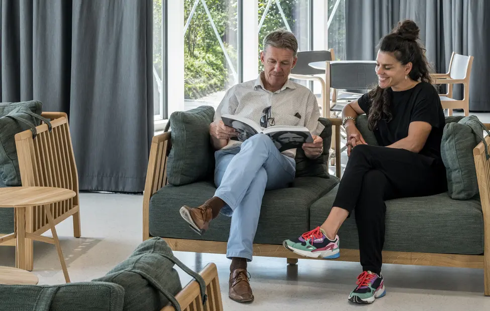 People relaxing on couches