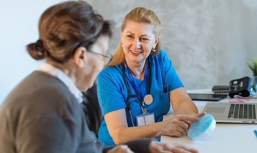Doctor with senior woman in an office