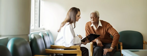 A doctor talks to a heart patient