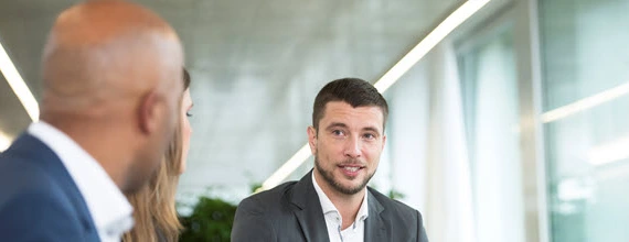 A Novartis associate in a business meeting